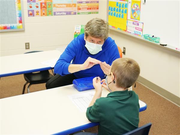 Becky Poston teaching student